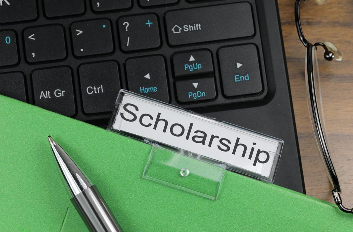 Students reviewing scholarship application materials
